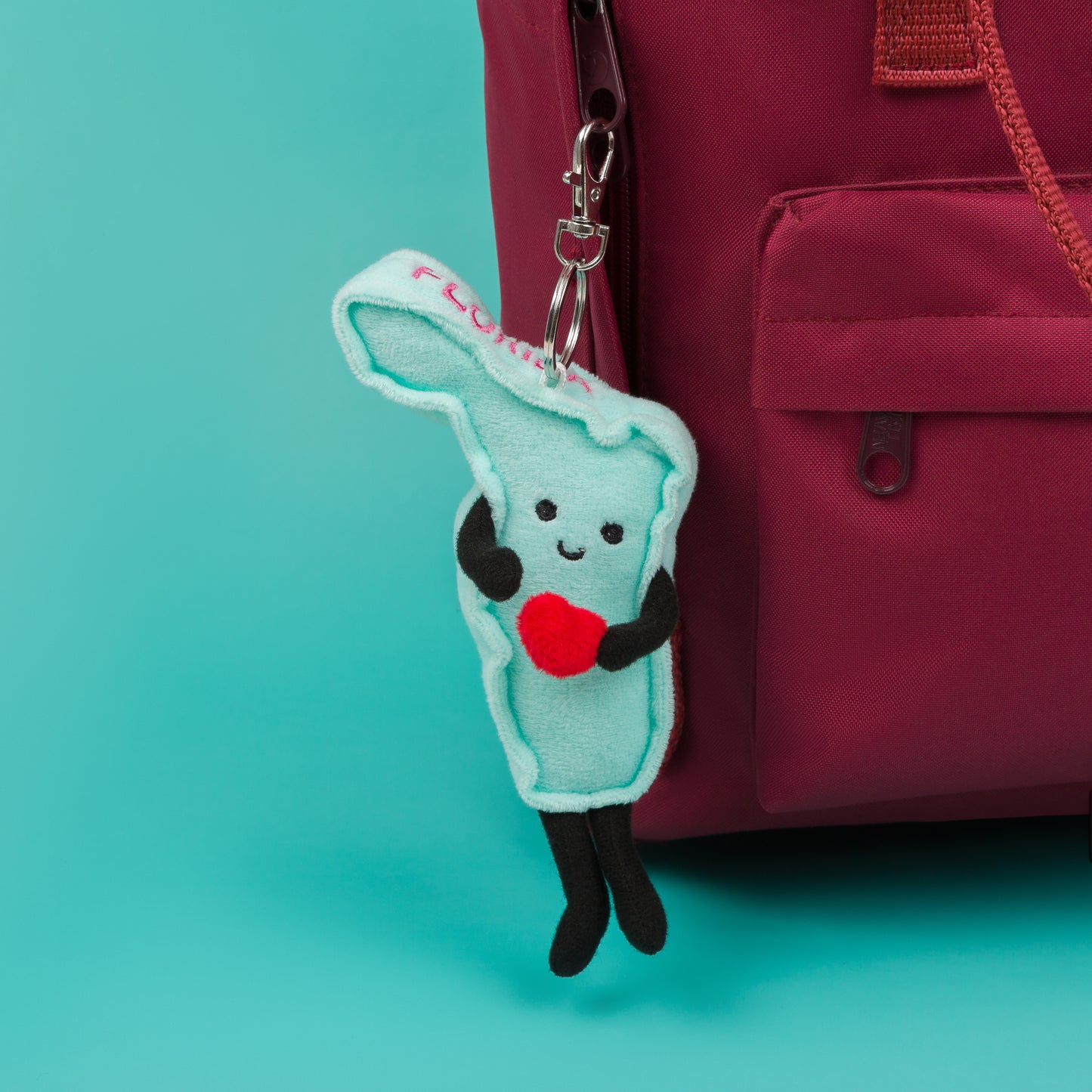 4-inch Florida-shaped plush bag charm mini, perfect for backpacks and keyrings with detailed stitching.