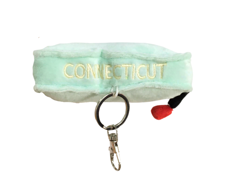 "Connecticut Plush Bag Charm – a soft, miniature plush in the shape of Connecticut, featuring a durable clasp for attaching to bags, backpacks, or keys."